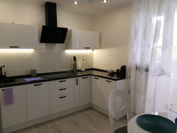 White Kitchen And Black Hood Interior