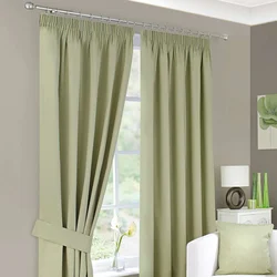 Gray-Green Curtains In The Living Room Interior