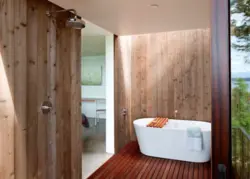 Bathtub with PVC wood panels photo