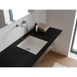 Built-in countertop sinks in the bathroom photo