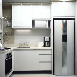 Corner kitchen design with refrigerator by the door