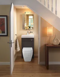 Bathroom design under the stairs in the house