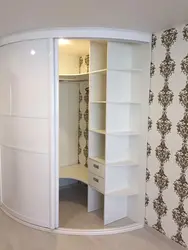 Corner wardrobe with drawers in the bedroom photo