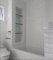 Bathroom built into a niche photo