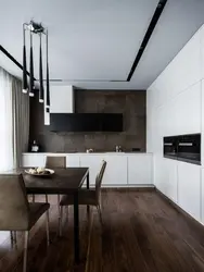 Kitchen design with dark floors and light walls