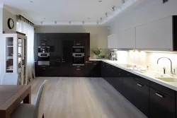 Kitchen design with dark floors and light walls