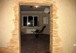Doorway made of decorative stone in an apartment photo