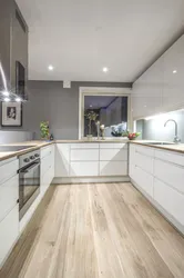 Glossy kitchen with wooden countertops in the interior