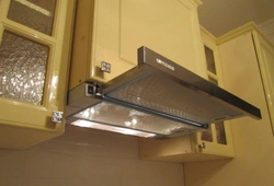 How to attach the hood in the kitchen above the stove to the wall photo