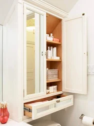 Narrow cabinet in the bathroom photo