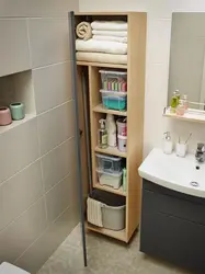 Narrow cabinet in the bathroom photo