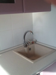 Kitchen sink against the wall photo