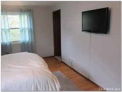 Высота телевизора в спальне на стене фото