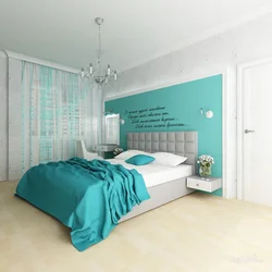 Інтэр'ер спальні з ложкам бірузовага колеру