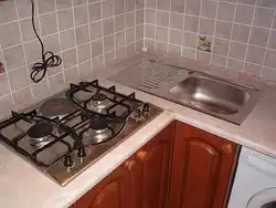 Stove and sink in a small kitchen photo