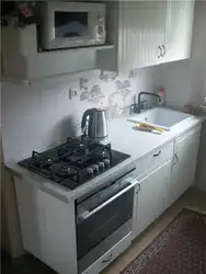 Stove and sink in a small kitchen photo