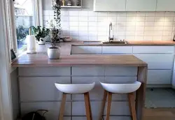 Photo of a kitchen with a table by the window photo