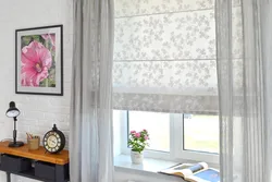Roller blinds with tulle in the kitchen interior