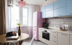 Corner kitchen design photo with refrigerator by the window