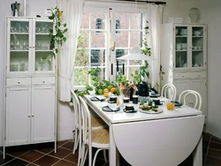 Kitchen design with a table by the window