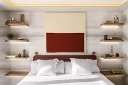 Shelves above the bed in the bedroom photo