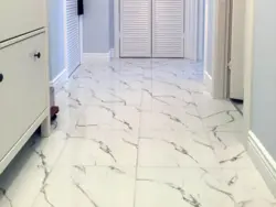 Porcelain tiles for flooring in the kitchen and hallway photo
