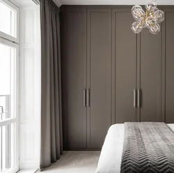 Gray wardrobe in the bedroom interior photo