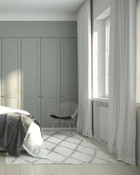 Gray wardrobe in the bedroom interior photo