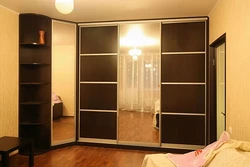 Corner wardrobes in the living room with a mirror photo
