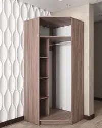 Corner wardrobe for clothes in the bedroom with a mirror photo