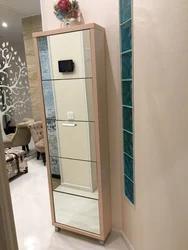 Hallway wardrobe and shoe rack with mirror photo