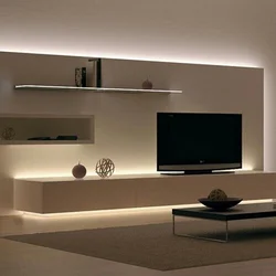 Modern shelves on the wall in the living room with TV photo