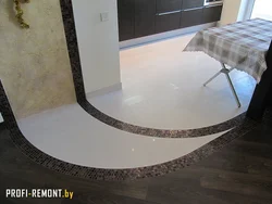 Tiles On The Floor In The Kitchen With A Transition Photo