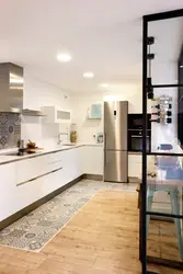 Tiles On The Floor In The Kitchen With A Transition Photo