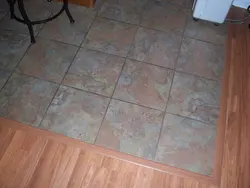 Tiles on the floor in the kitchen with a transition photo