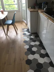 Tiles on the floor in the kitchen with a transition photo