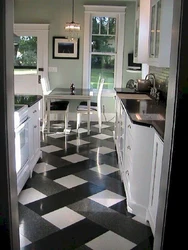 Tiles on the floor in the kitchen with a transition photo