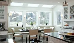 Photo of a kitchen with a dining table by the window