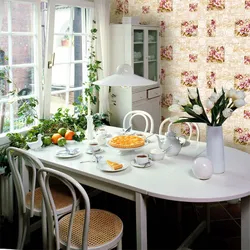 Photo of a kitchen with a dining table by the window