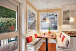 Photo of a kitchen with a dining table by the window