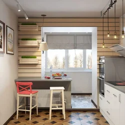 Interior of a rectangular kitchen with access to the balcony