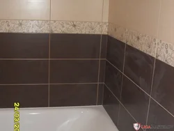 Photo of a bathroom with a dark bottom