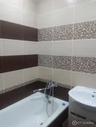 Photo of a bathroom with a dark bottom