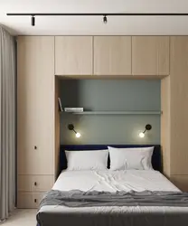 Bedroom interior with wardrobes on the sides