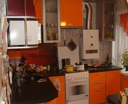 Small kitchen with refrigerator and gas water heater photo