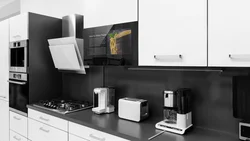 Black household appliances in the kitchen interior