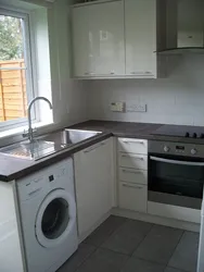 Kitchen design with refrigerator and washing machine photo