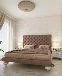 Bedroom interior with a soft bed in beige
