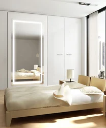 Bedroom interiors with mirrored wardrobe
