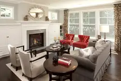 Armchairs in the interior of the living room with a fireplace